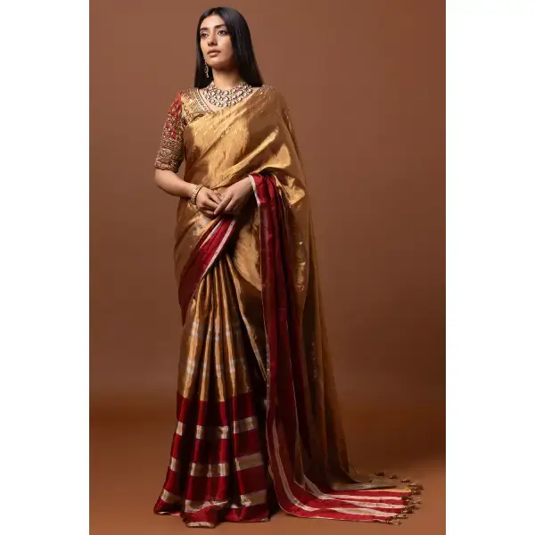 SEASONS-GOLD AND RED CLASSIC SAREE SET PAIRED WITH A MATCHING HAND EMBROIDERED BLOUSE AND MIRROR DETAILS.