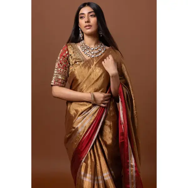 SEASONS-GOLD AND RED CLASSIC SAREE SET PAIRED WITH A MATCHING HAND EMBROIDERED BLOUSE AND MIRROR DETAILS.